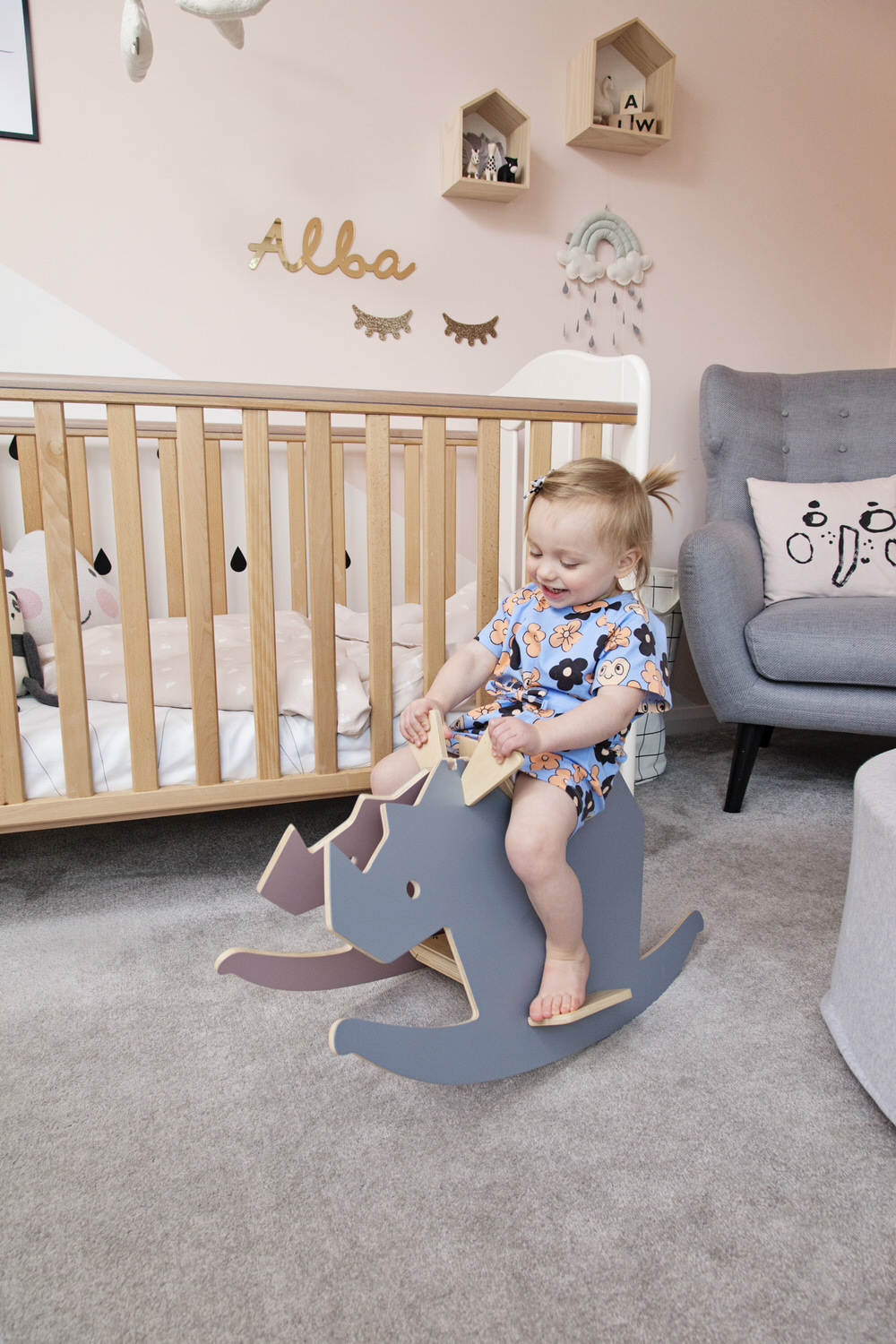 Sebra Rhino Rocker | A pastel and monochrome nursery for a little girl with details from The Modern Nursery.