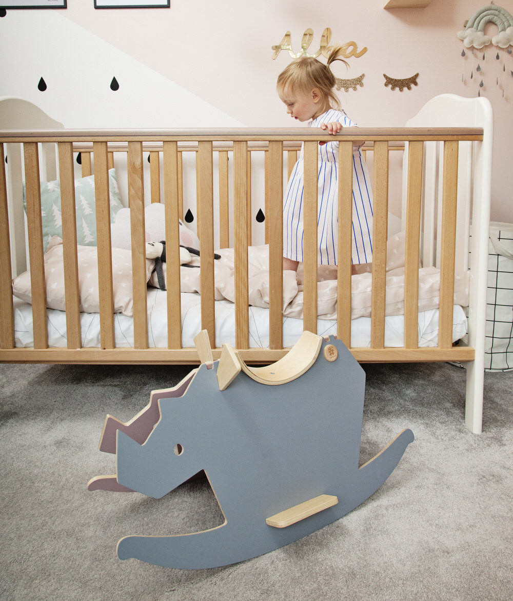 Wooden Scandi Style Cot A pastel and monochrome nursery for a little girl with details from The Modern Nursery.