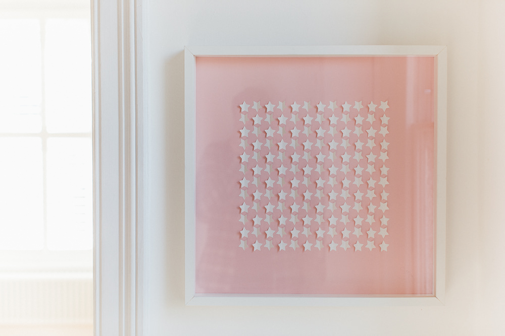 Pastel-pink 3D star wall art