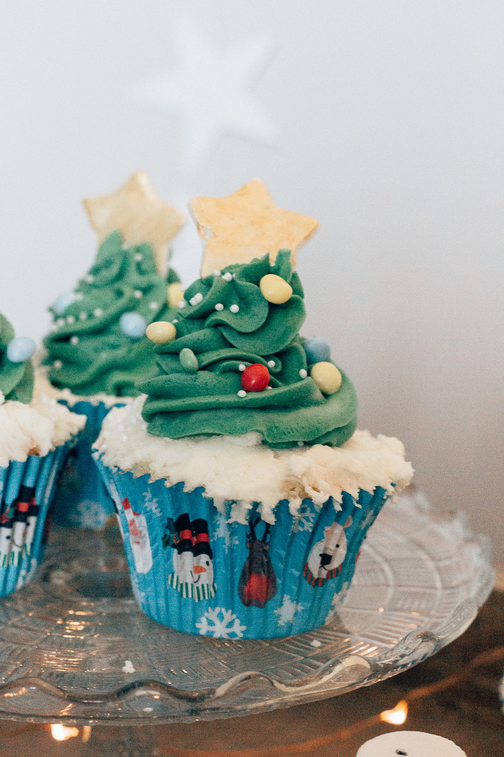 Christmas tree swirl cupcakes with chocolate baubles and fondant star topper