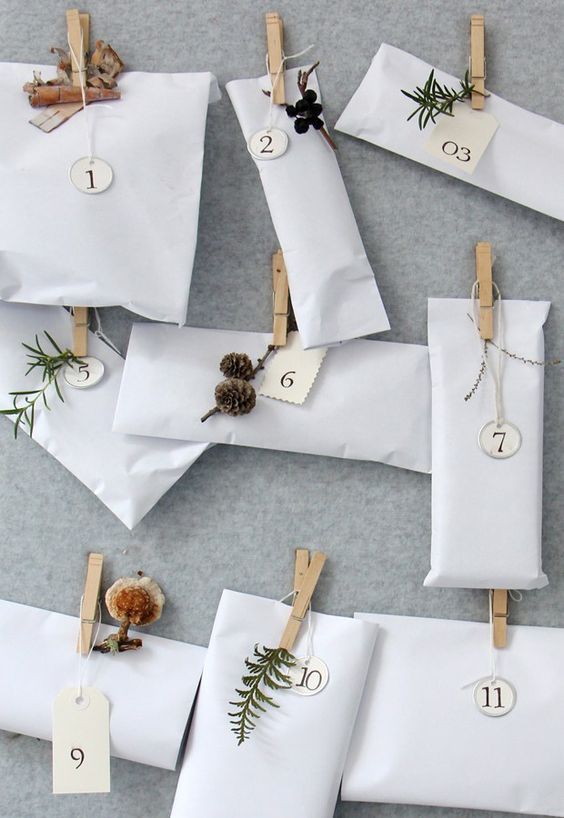 Homemade Advent Calendars For Kids. White packages and wooden pegs.