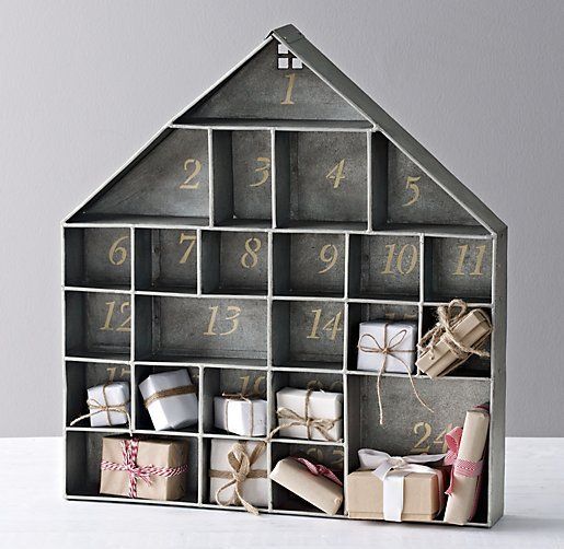 Homemade Advent Calendars For Kids. Wooden house advent calendar painted grey and filled with treats.