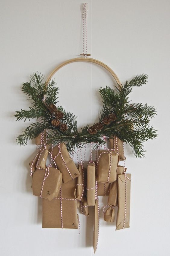 Homemade Advent Calendars For Kids. Wreath shaped advent calendar with brown paper packages tied up with string.