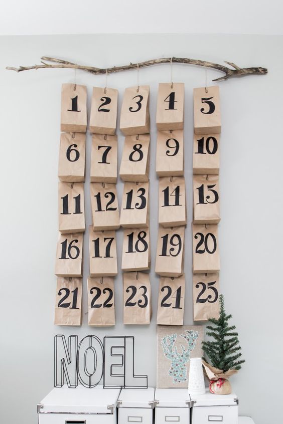Homemade Advent Calendars For Kids. Brown paper bags advent calendar decorated with handwritten numbers.
