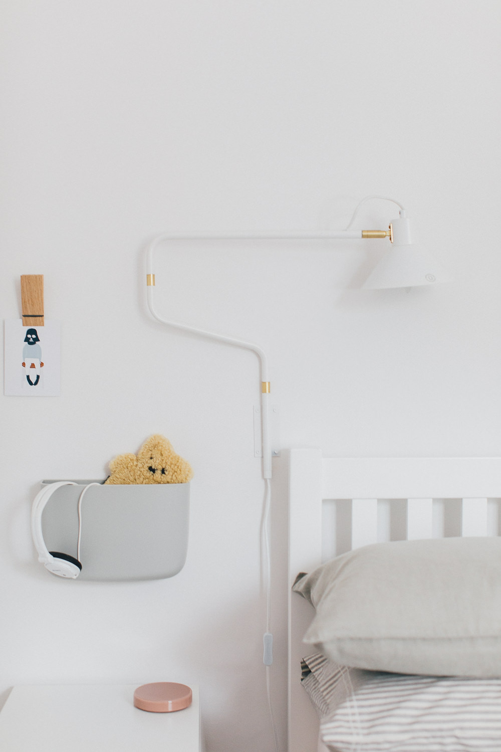 Statement wall light | Wall pockets | Childrens Room | Cloud decor | Peg wall hook | A modern neutral millennial pink bedroom for children with handmade furniture, personalised artwork and statement lighting