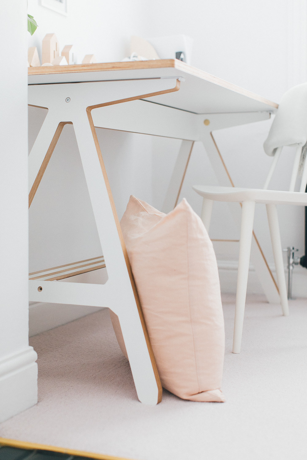 Blush Pink Cushion | A Frame Desk | Neutral Desk Accessories | White Desk Chair | Statement Wall Light | A modern neutral millennial pink bedroom for children with handmade furniture, personalised artwork and statement lighting