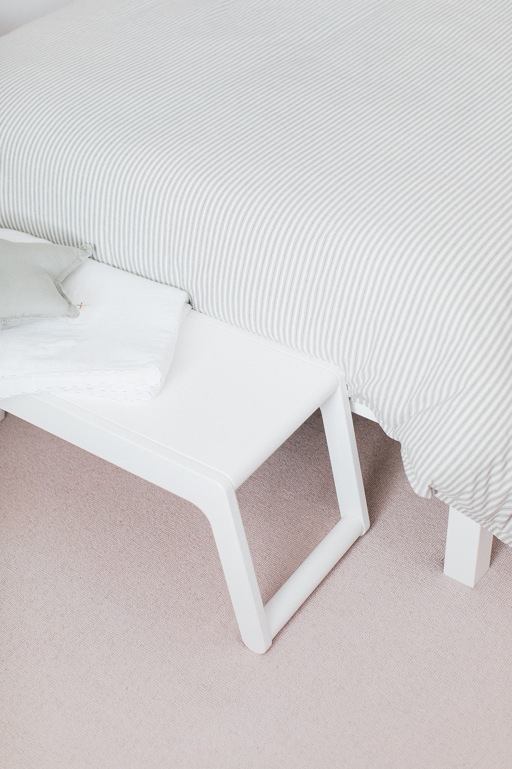 White bench | Toast bedding | A modern neutral millennial pink bedroom for children with handmade furniture, personalised artwork and statement lighting