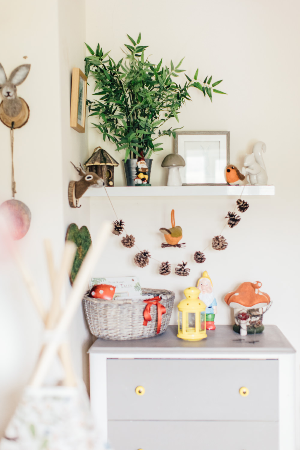 Shelfie | Woodland Decor | Bright toys and wall decor in a woodland inspired children's bedroom in a rented property with homemade decor and details.