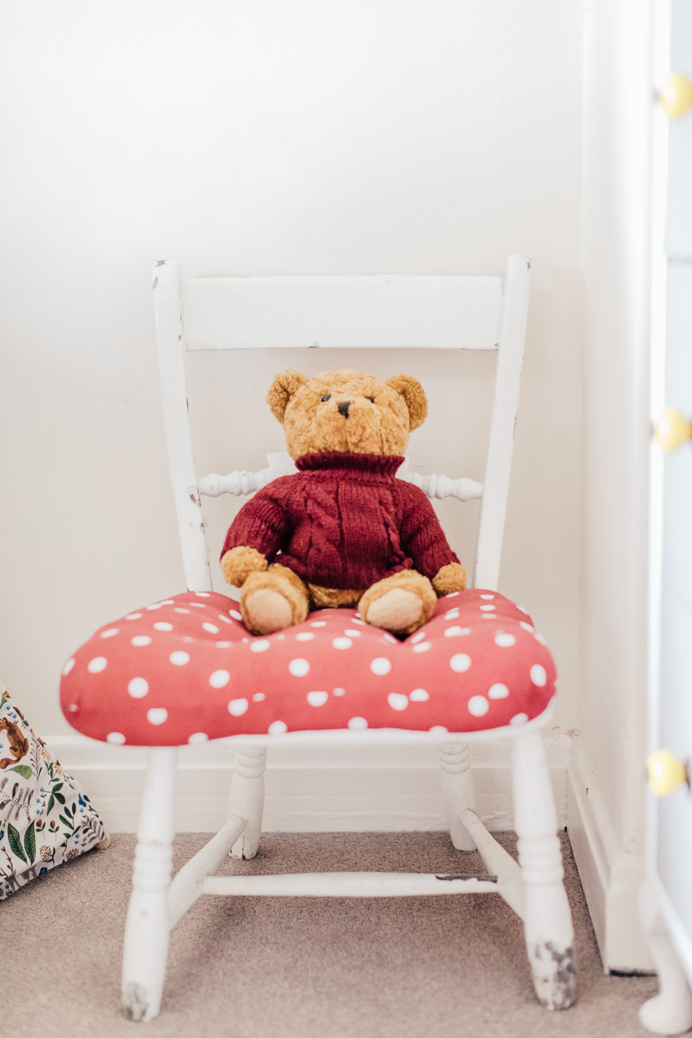 Bright toys in a woodland inspired children's bedroom in a rented property with homemade decor and details.