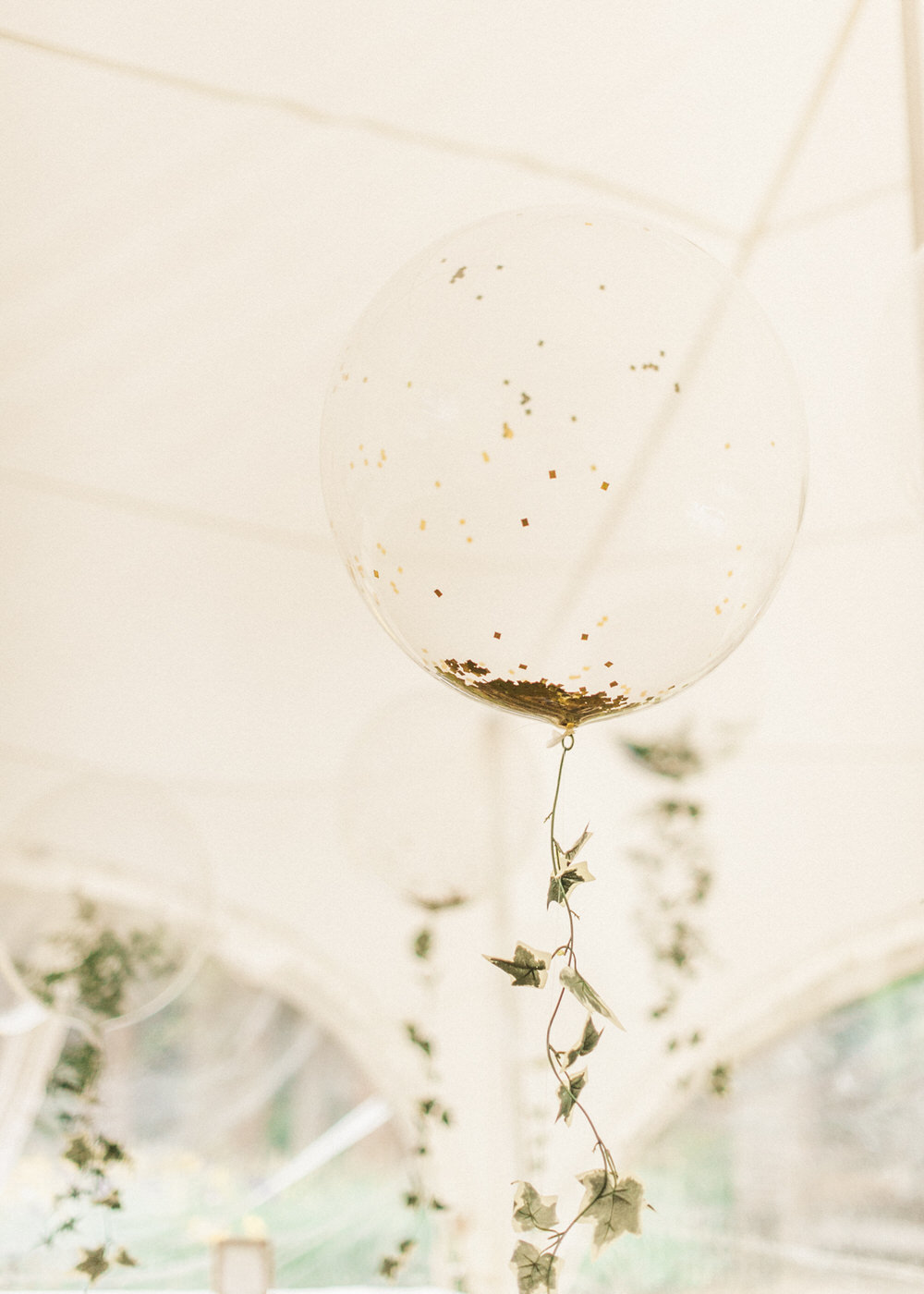 Helium balloons with floral tails | A Midsummer nights dream inspired children's birthday party with stunning floral, fairy entertainment, crafts and a picnic. Photos by Kate Nielen.