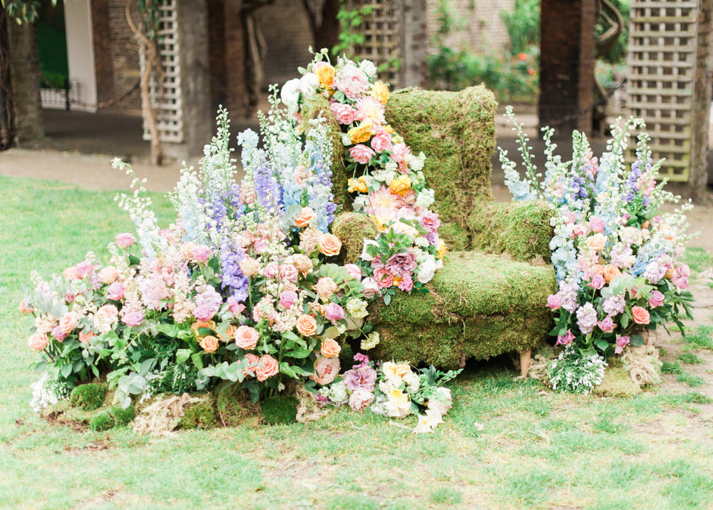 Floral Chair | Stunning floral display | Pastel wildflower Display | Floral centrepieces | Wildflower centrepiece | Summer florals | Childrens Party | A Midsummer nights dream inspired children's birthday party with stunning floral, fairy entertainment, crafts and a picnic. Photos by Kate Nielen.