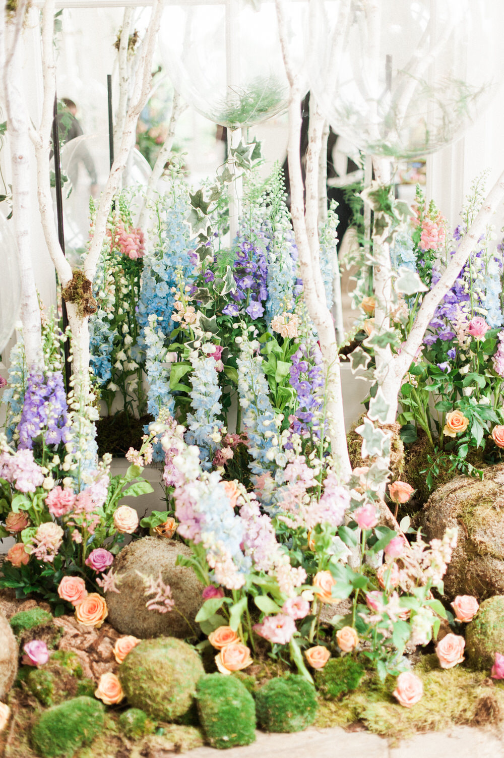 Stunning floral display | | Purple, blue and peace flowers | Pastel wildflower Display | Floral centrepieces | Wildflower centrepiece | Summer florals | Childrens Party | A Midsummer nights dream inspired children's birthday party with stunning floral, fairy entertainment, crafts and a picnic. Photos by Kate Nielen.