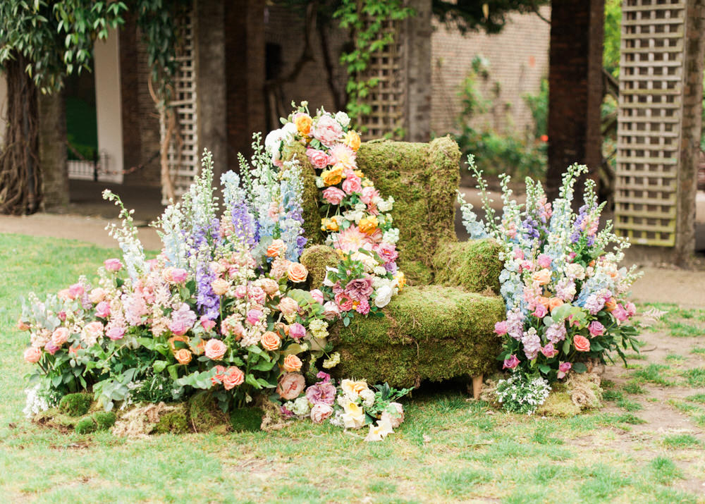 Floral Chair | Stunning floral display | Pastel wildflower Display | Floral centrepieces | Wildflower centrepiece | Summer florals | Childrens Party | A Midsummer nights dream inspired children's birthday party with stunning floral, fairy entertainment, crafts and a picnic. Photos by Kate Nielen.