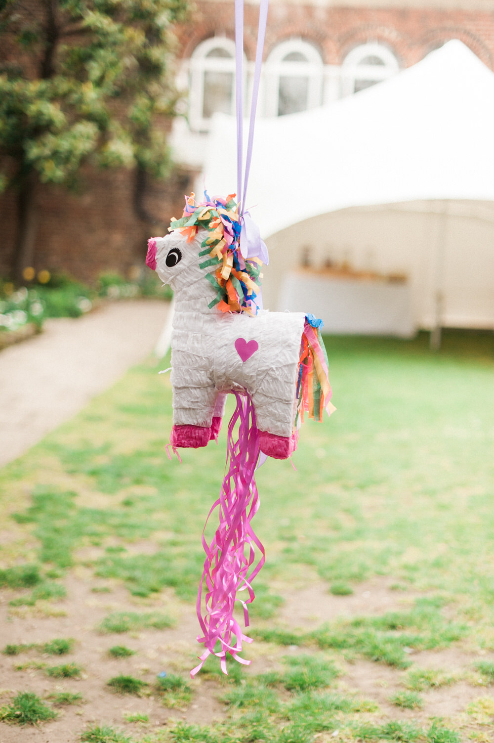 Pinatas | Unicorn Piñata | A Midsummer nights dream inspired children's birthday party with stunning floral, fairy entertainment, crafts and a picnic. Photos by Kate Nielen.